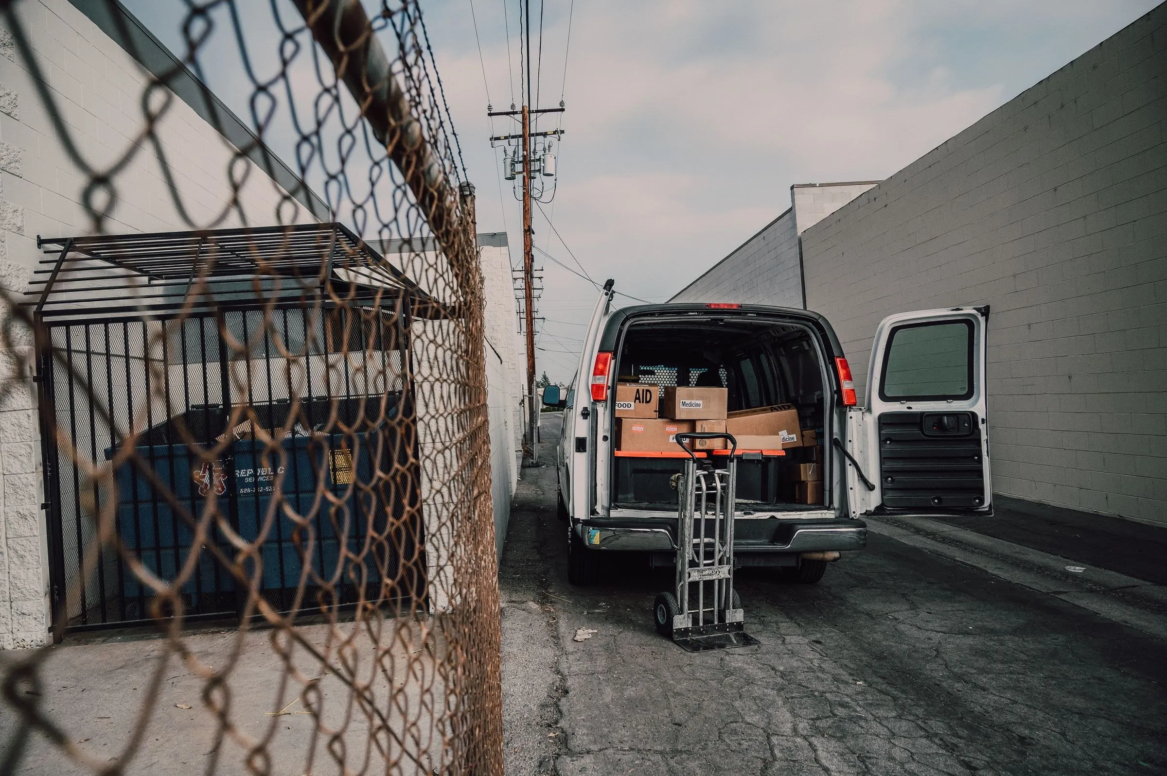 A van being loaded with boxes on moving day